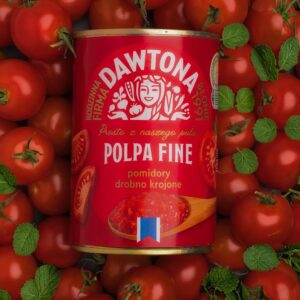 Dawtona canned tomatoes surrounded by fresh cherry tomatoes and mint leaves.