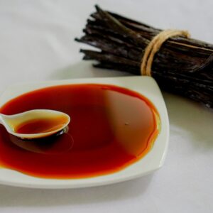 a spoon is sitting in a bowl of red liquid