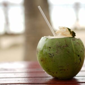 green fruit on brown wooden table